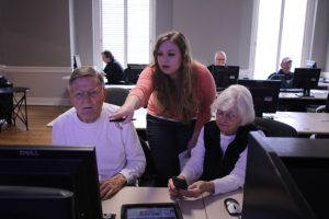 Knight Scholar Jayme Keefer (center) developed online learning resources for mobile technologies.